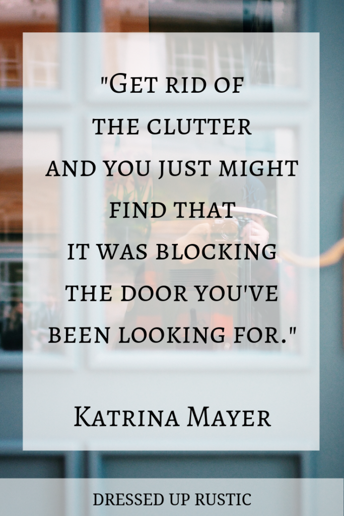 Inspirational Quote about organization by Katrina Mayer layered over a dusty blue door (close up of the door). The quote is meant to motivate and inspire you to create an organized home and declutter your spaces.