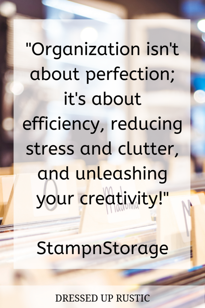 Organization Quote by StampnStorage about releasing perfection. It's layered over a close up of file tabs within a drawer of files. The quote is meant to motivate and inspire you to create an organized home and declutter your spaces.