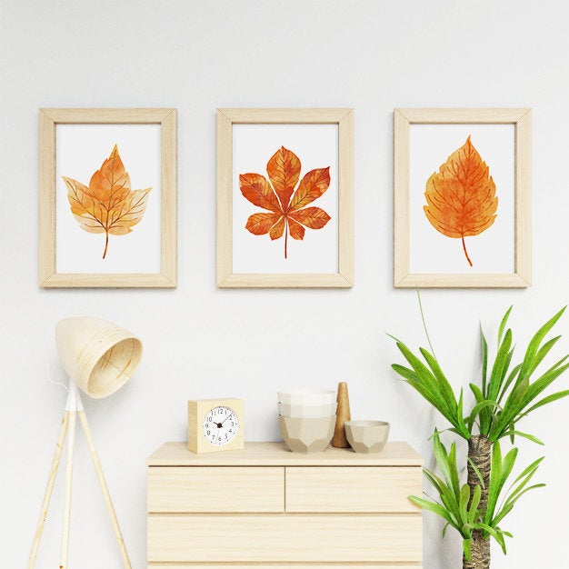 three framed canvases of orange Autumn leaves wall art