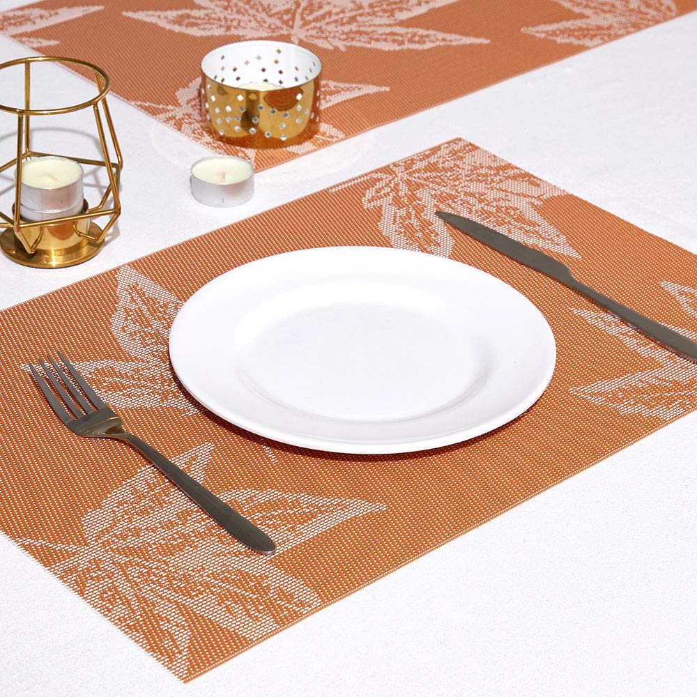 These orange autumn maple leaf placemats are vinyl, no slip, easy to clean, and heat resistant.