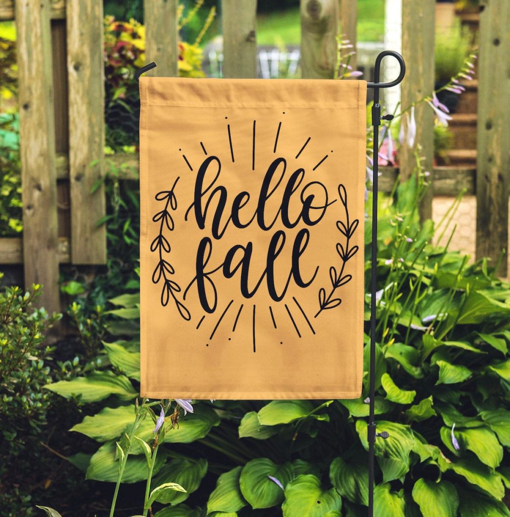 hello fall garden sign that hangs on a garden flag pole, a fun fall farmhouse decor idea