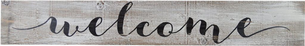 a gray rustic barnwood sign that says "welcome" in cursive