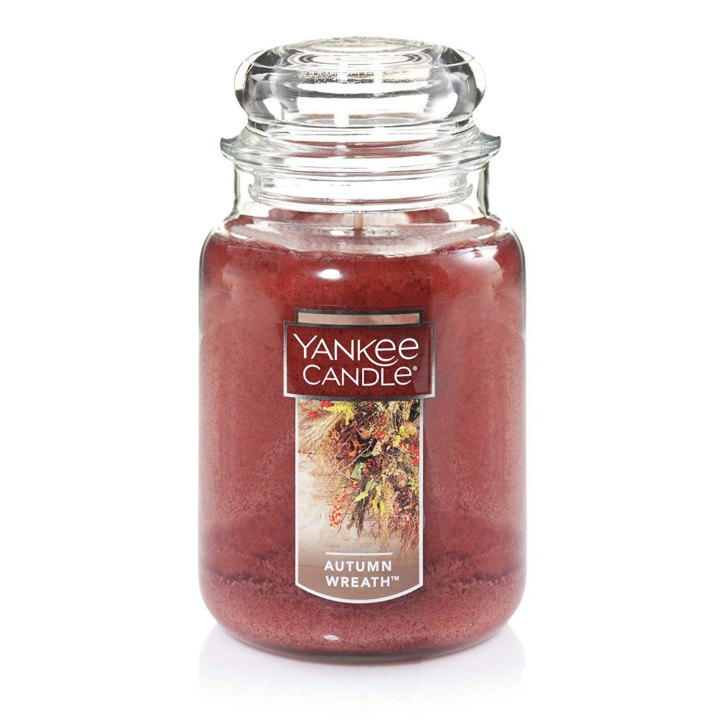 a red Yankee Candle makes for great fall farmhouse decor and the autumn wreath scent smells amazing